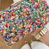 Clutch piedrecitas multicolor y rojas Rachel